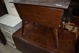 A mid century style sewing box table