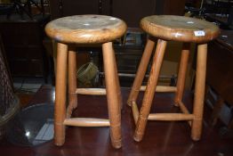 A pair of traditional pine stools