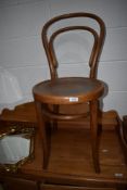 A bent wood chair with beech wood frame