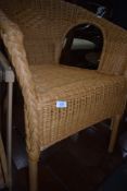 A woven fibre tub chair