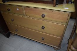 A yellow pine chest of two over two drawers with turned handles