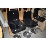 Three adjustable chrome kitchen stools