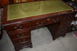 A reproduction Regency pedestal desk