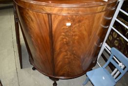 An Edwardian side cabinet having flame veneer frontage