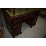 A reproduction Regency pedestal desk