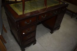 A reproduction Regency pedestal desk