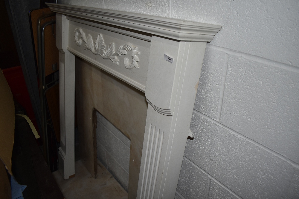 A painted wood fire surround with marble back and hearth