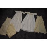 A collection of Victorian childrens under garments/pinafores in wool and cotton dresses, some lovely