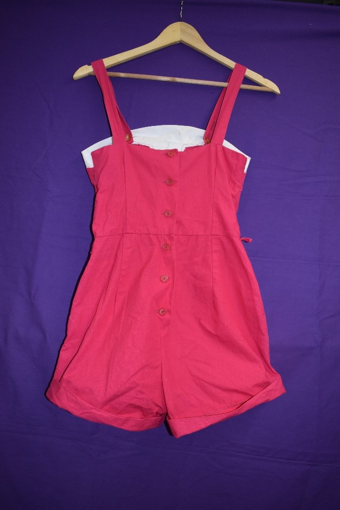 A 1950s Cerise and white cotton playsuit having pockets to front and button fastening to back. - Image 4 of 4