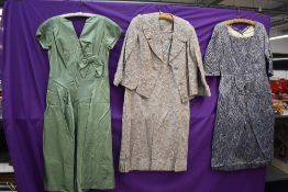 Three 1950s and 60s dresses, including pale green satin gown.