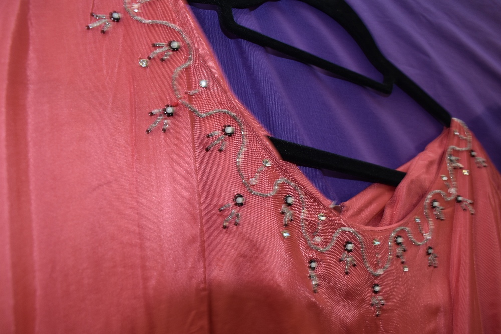 Four 1940s and 1950s gowns, mixed sizes and colours, zip replacement needed to one pink gown. - Image 6 of 6