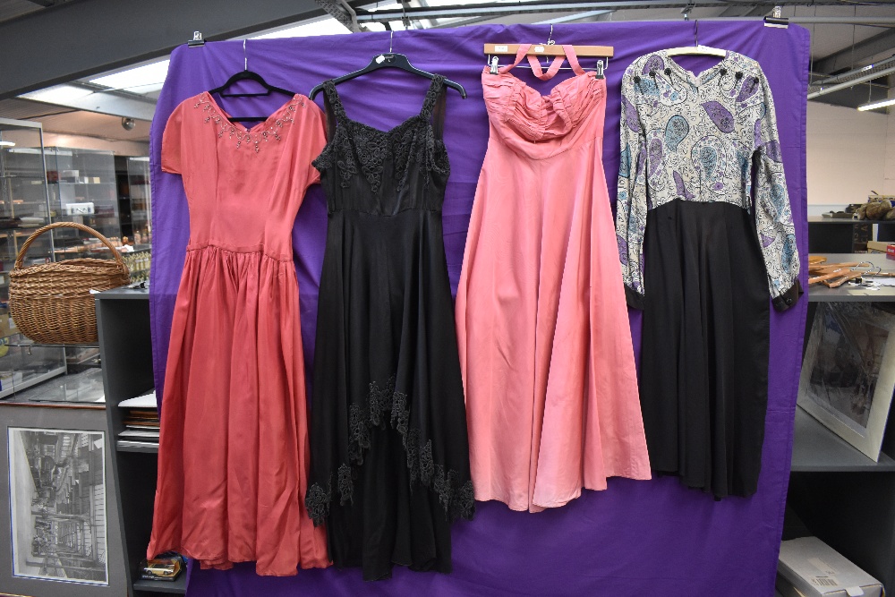 Four 1940s and 1950s gowns, mixed sizes and colours, zip replacement needed to one pink gown.