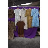 Six ladies vintage and retro dresses and a blouse, medium sizes, mixed styles.