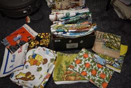 An extensive collection of vintage souvenir and novelty tea towels, the majority appear unused, also