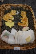 A wicker basket containing an assortment of vintage fuzzy animal appliques to sew onto childrens