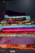A wonderful assortment of vintage fabrics including silks, dog tooth, wool, bright mid century