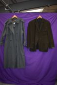 A gents 1960s Aquascutum overcoat with three pockets to front in dark green and a classic styled