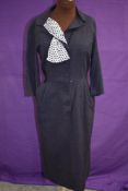 A vintage American 1950s day dress by Puritan having lovely polker dot faux neckerchief detail,