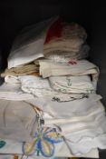 A good quantity of mixed vintage and antique table linen, a lot having extensive embroidery.