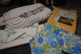 A vintage candlewick bedspread,an unused 1960s bedding set including pillow cases, a similar