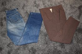 A scarce pair of American 1940s/50s ladies side zip high waisted jeans and a pair of brown slacks