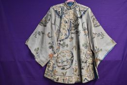 An early 20th century Kimono jacket having hand painted floral and scenic designs and incredibly
