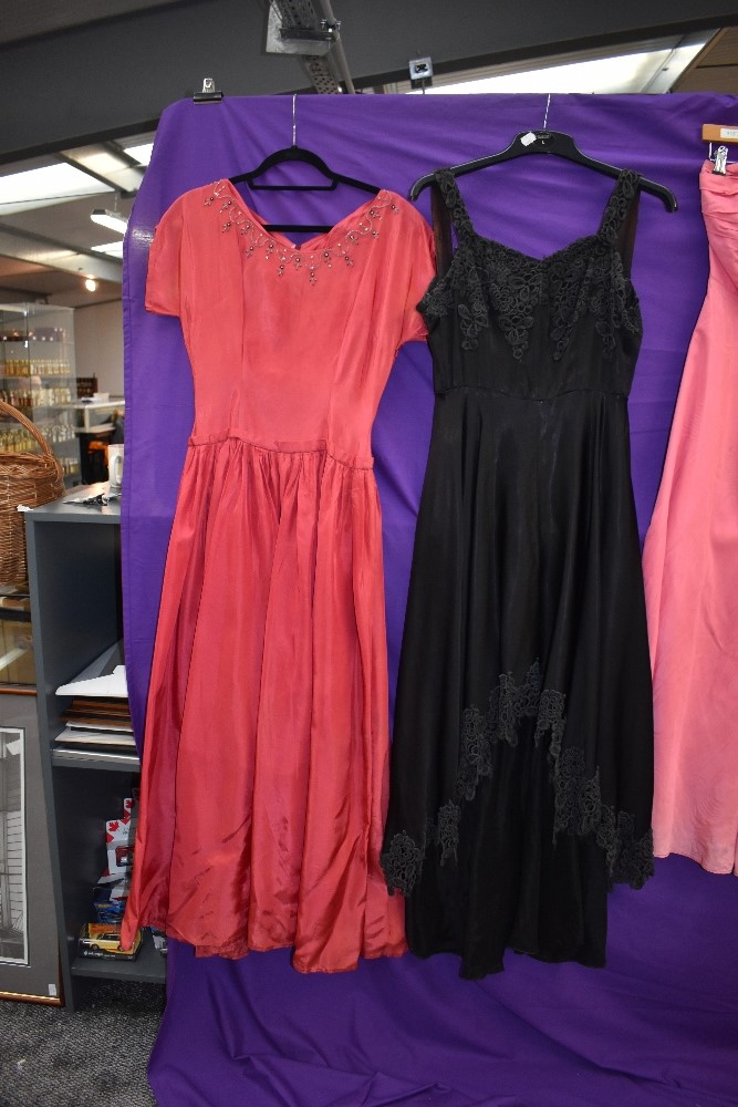 Four 1940s and 1950s gowns, mixed sizes and colours, zip replacement needed to one pink gown. - Image 4 of 6