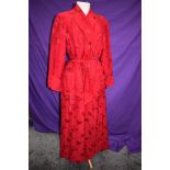 A full length Chinese dressing gown or house coat in cherry red silk or silk blend fabric, frog