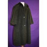 A late 1950s/ early 60s Skee tex of London moss green coat with integrated cape.