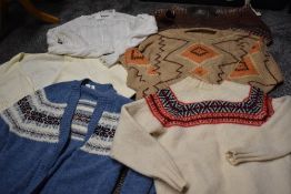A collection of vintage jumpers including unworn Fair isle Shetland cardigan and similar, also