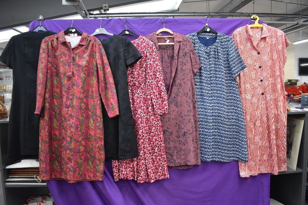 Seven vintage and retro dresses,including colourful prints, mixed styles and sizes.