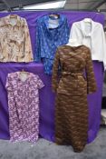 A mixed lot of ladies 1970s clothing including blouse, skirt suit and dresses.