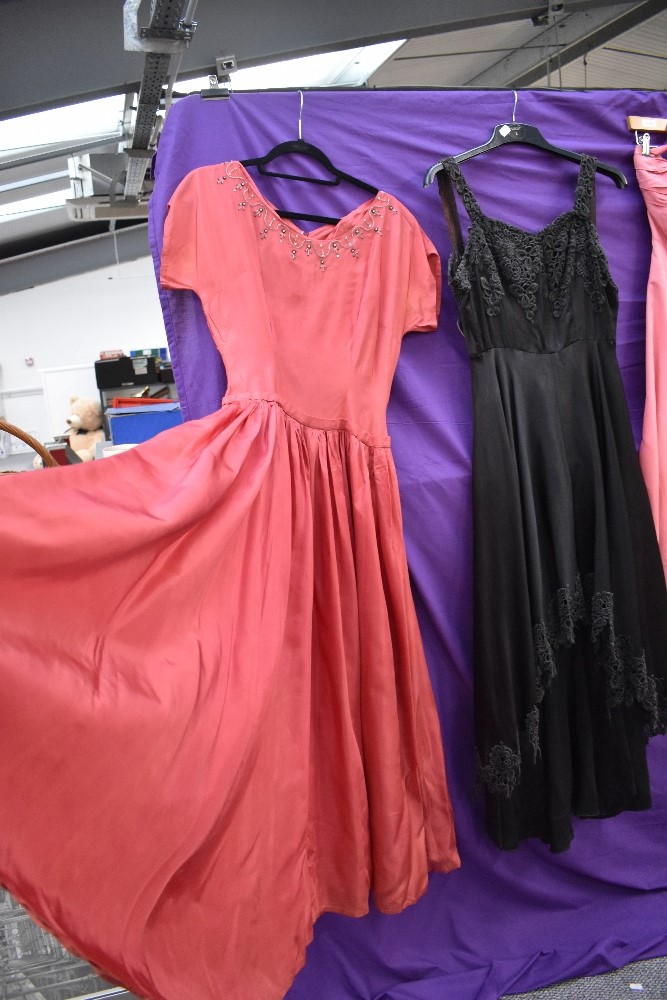 Four 1940s and 1950s gowns, mixed sizes and colours, zip replacement needed to one pink gown. - Image 5 of 6
