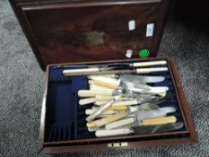 A small mahogany cased canteen of cutlery