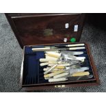 A small mahogany cased canteen of cutlery