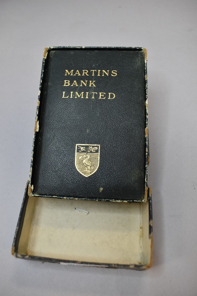 a vintage penny saving money bank for Martins Bank with box