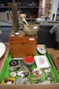 A selection of curios and trinkets including spirit bottle name tags and pen knives