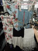 Five ladies summer dresses in light fabrics