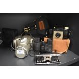 A selection of cameras and binoculars including Olympus and Brownie 127