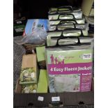 A selection of gardening and bird feeding items including plant frost jackets