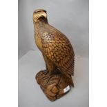 A hand carved wooden sculpture of an American style eagle