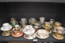 A large selection of tea cups and saucer sets including blue and white wear and hand painted sets.