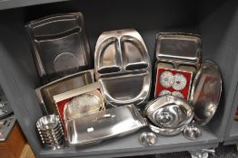 A selection of stainless steel kitchen wares and serving trays