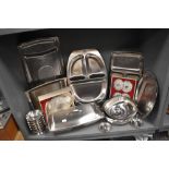 A selection of stainless steel kitchen wares and serving trays