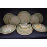A part dinner service by Clarice Cliff having a hand decorated design on cream ground
