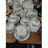 A part tea service in porcelain having blue transfer print and swirl design