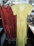 A 1940s full length yellow gown and a 1930s day dress.