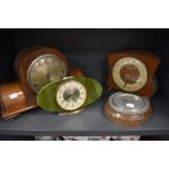 A selection of art deco mantle clocks including stone effect and an oak cased barrometer
