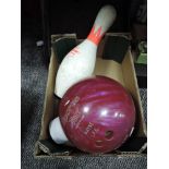 A vintage Pro Line bowling ball in pink and a matching pin