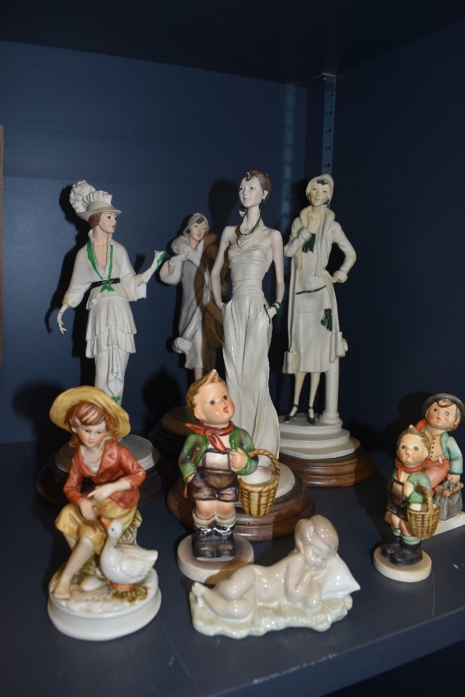 A selection of figures including Lladro and Nao